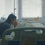 Mother sitting with a sick child in a hospital