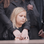 Child at a funeral