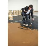 Wim T. Schippers creating his peanut butter floor artwork