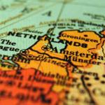 Map of the Netherlands, including Amsterdam, Rotterdam, The Hague, Groningen, and the Frisiand Islands alongside border regions of Belgium and Germany