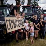 Farmers, their families standing by their trucks during a protest against the Dutch government’s nitrogen plans. July 27, 2026.