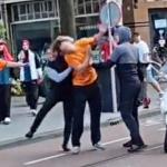 A man attacks a man in an Oranje shirt with a bike chain in Amsterdam-Zuid after the Oranje-Morocco World Cup match, June 30, 2026.