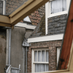 View through an open window of the facades of an interior patio in Amsterdam