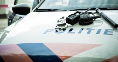 Handcuffs, radio Dutch Police Car
