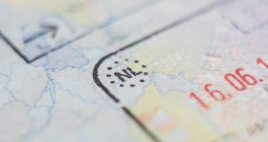 A Dutch stamp in a passport.