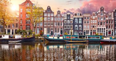 Apartments, businesses, and hotels along the Singel in Amsterdam. June 2025