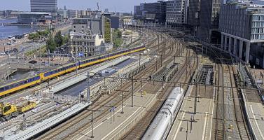A NS train leaves Amsterdam Centraal headed east on a hot Tuesday afternoon. 23 June 2026