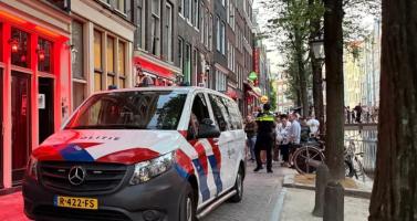Police raid multiple locations in Amsterdam's Red Light District as part of a major operation against human trafficking, 14 July 2026
